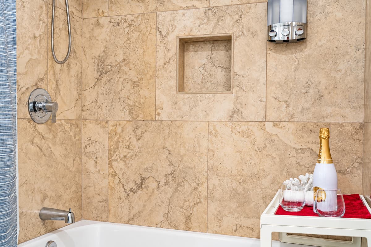Immerse yourself in a soothing bubble bath to unwind after a long day, or enjoy a refreshing shower to invigorate your senses.