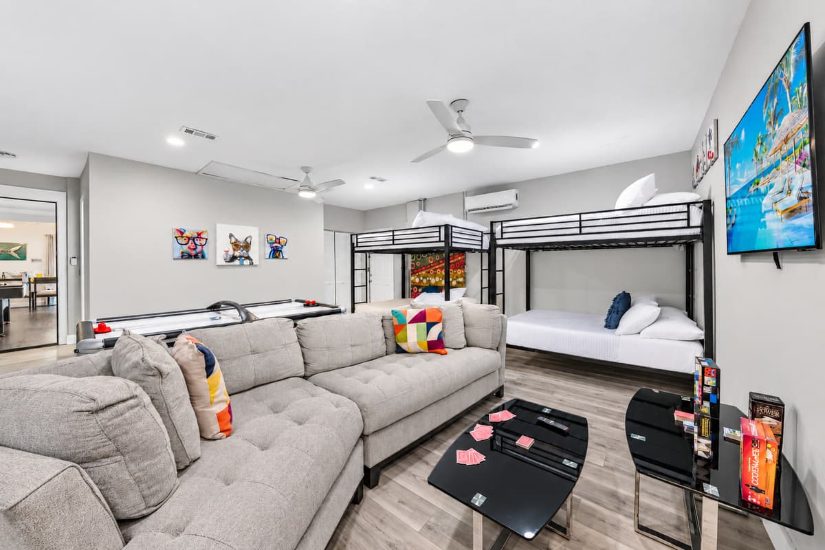 Spacious entertainment room designed for movie nights, games, and group fun.