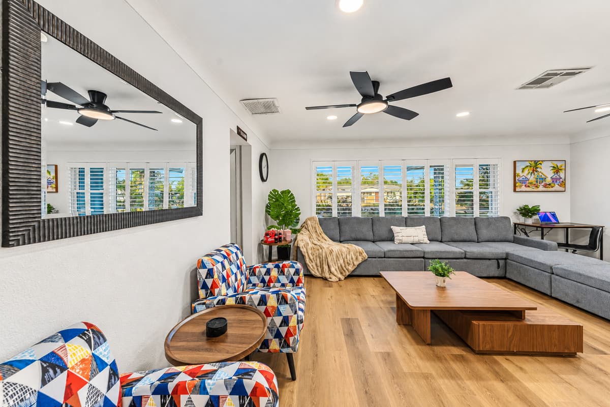 Spacious living room with large sectional seating, perfect for relaxing and gathering with your group 