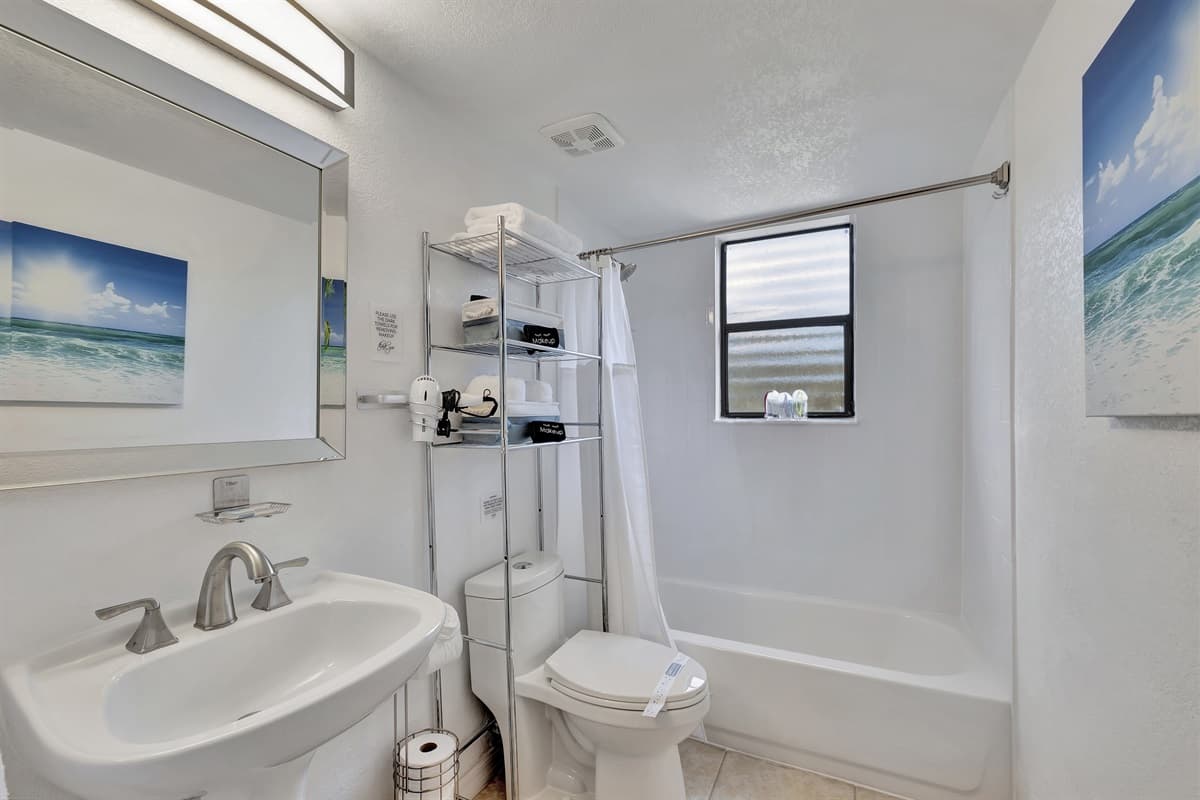 This bathroom is a perfect blend of functionality and style, ensuring that all your needs are met in a serene and inviting environment.