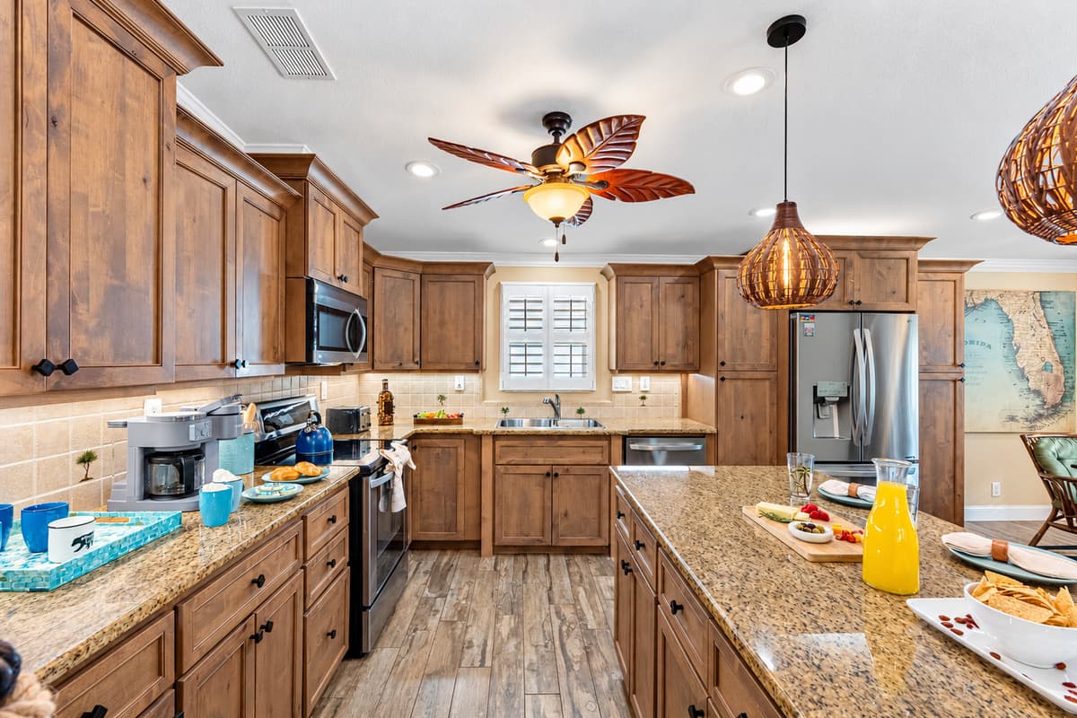 The heart of the home—this kitchen offers a perfect blend of style and functionality with rich wood cabinets and sleek stainless appliances.