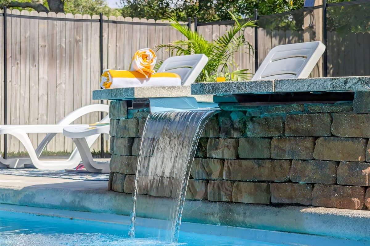 A true coastal retreat — relax by the pool, lounge on the deck, or enjoy a quiet evening under the stars in this serene backyard space.