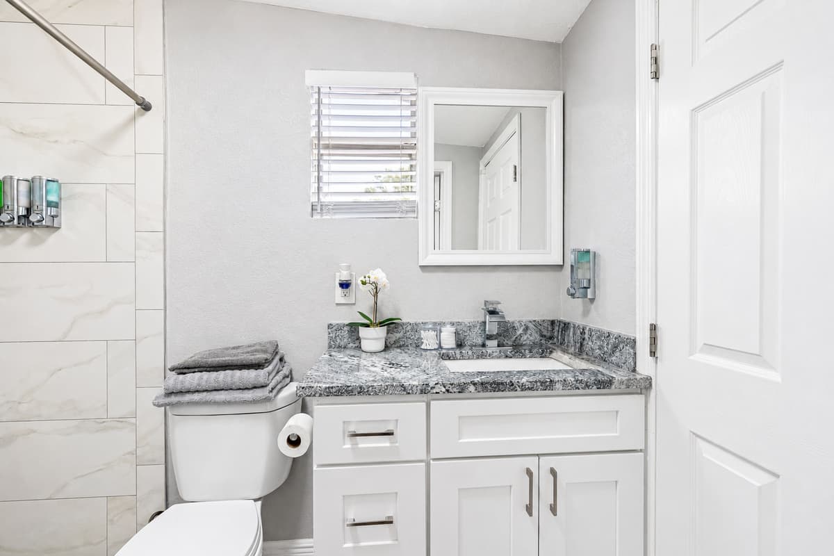 As you step inside, you'll be struck by the clean lines and elegant finishes that make this bathroom a true oasis.