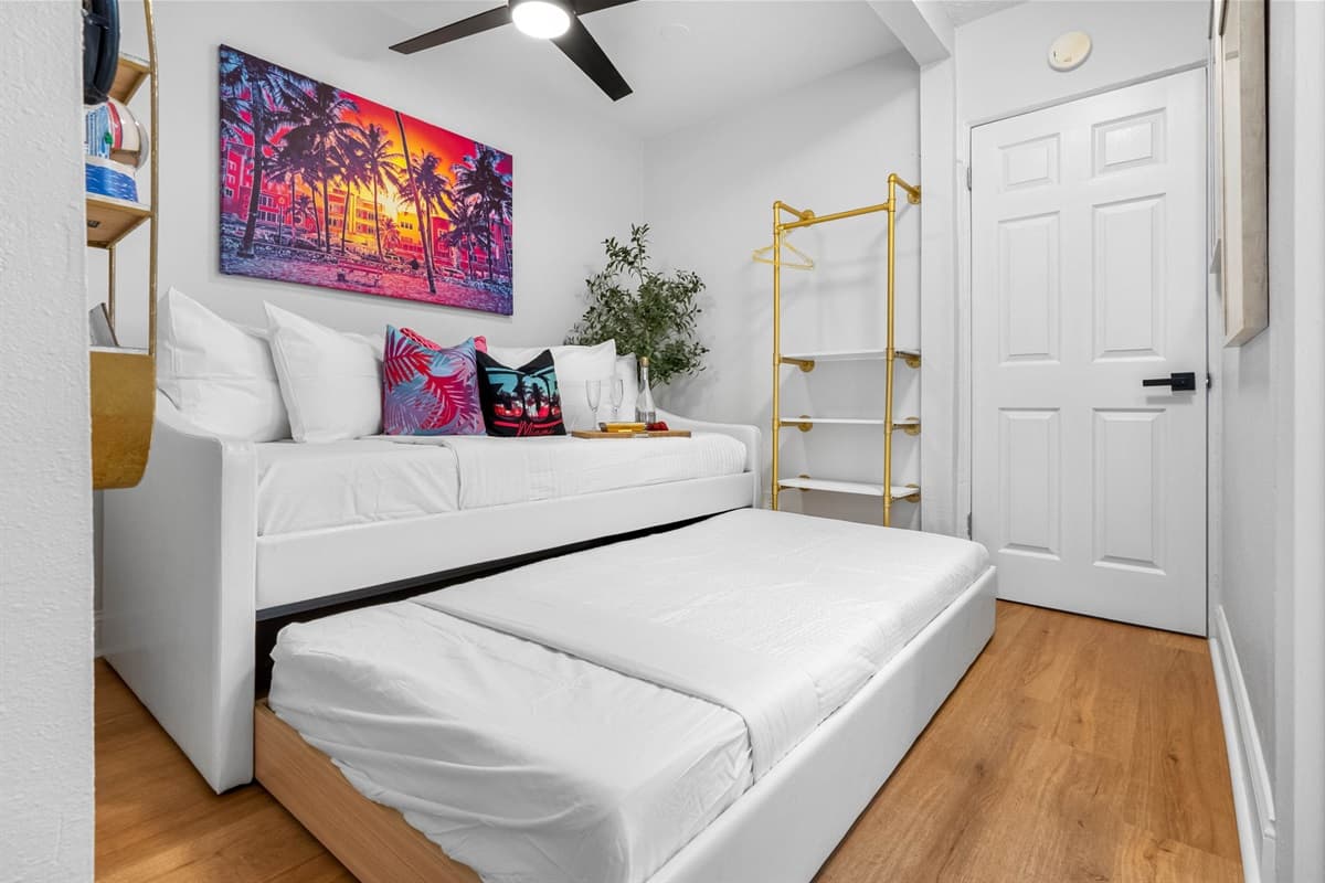 Beyond the private retreat lies a common space adorned with a twin-size bed and a Trundle.