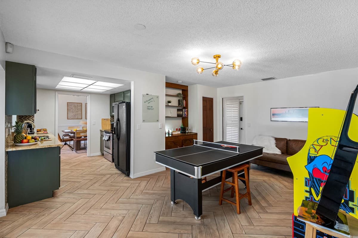 Whether you're into casual lounging or full-on battles, this game room has you covered. Enjoy a round of table tennis, perfect your aim with darts, or go for a high score on the Pac-Man arcade.