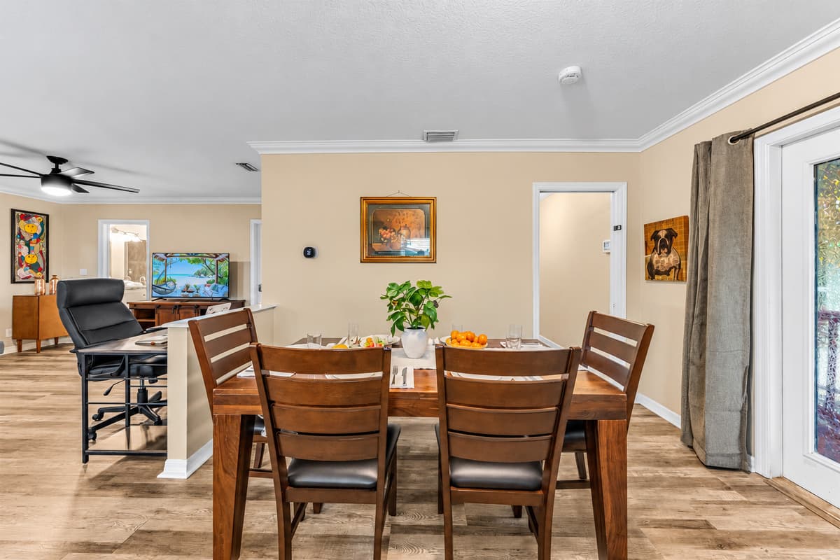 Open dining space flowing into the living room, creating a warm and social atmosphere.