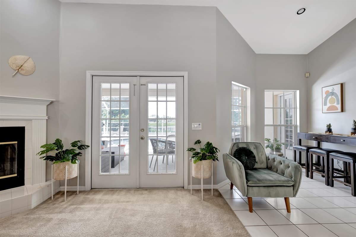 At the heart of the common area, a majestic fireplace beckons, casting a soft glow that invites you to gather around and bask in its comforting warmth.
