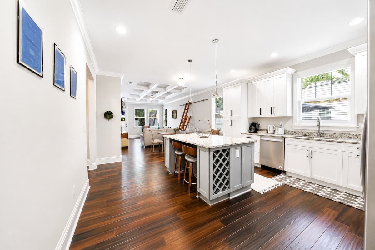 The kitchen flows seamlessly into the dining and living areas, creating the perfect space for entertaining.