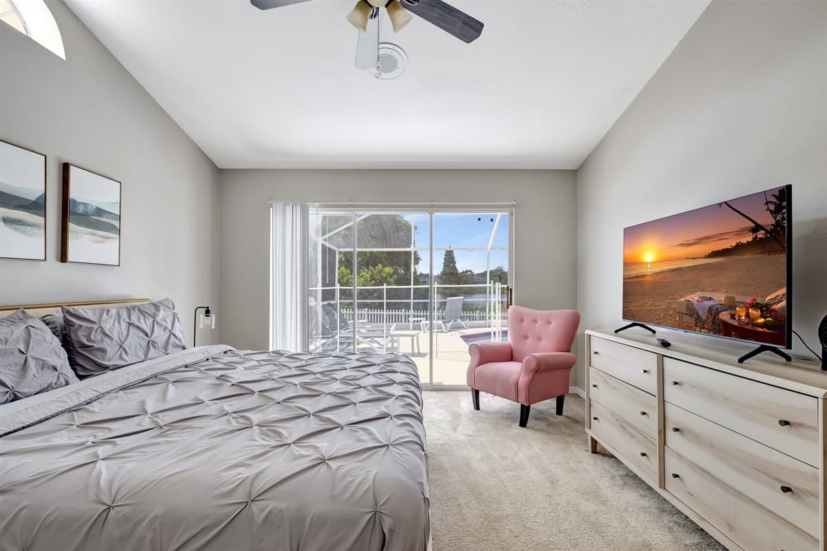 Open the sliding doors, and you'll be greeted by a breathtaking view of the pool, inviting you to take a refreshing dip or simply bask in the serenity of the outdoor oasis.
