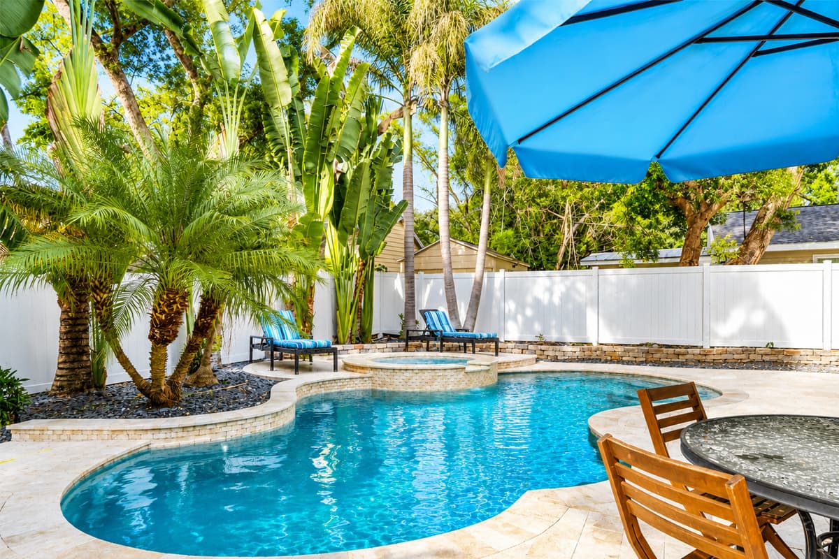 Spend your days relaxing by the crystal-clear pool surrounded by lush tropical landscaping and comfortable outdoor seating.