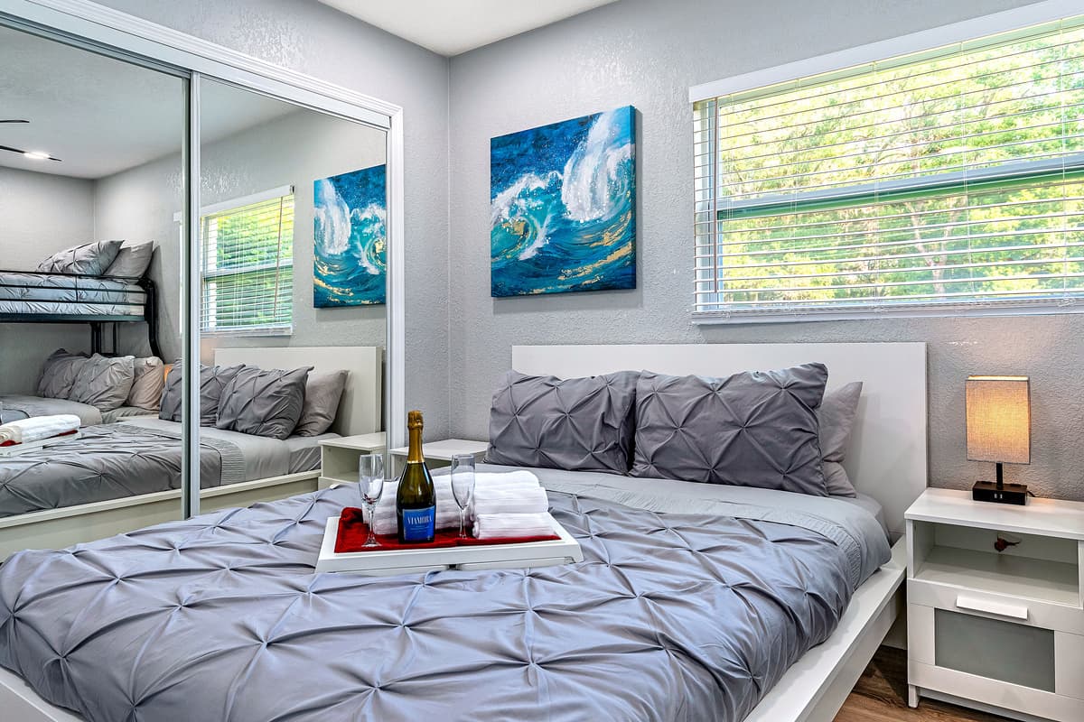 Lovely bedroom with a comfortable double sized bed and a bunk bed. This room also has its TV and a full length mirror closet. Have the best time with loved ones here! Send us a message if you have any questions regarding the property!
