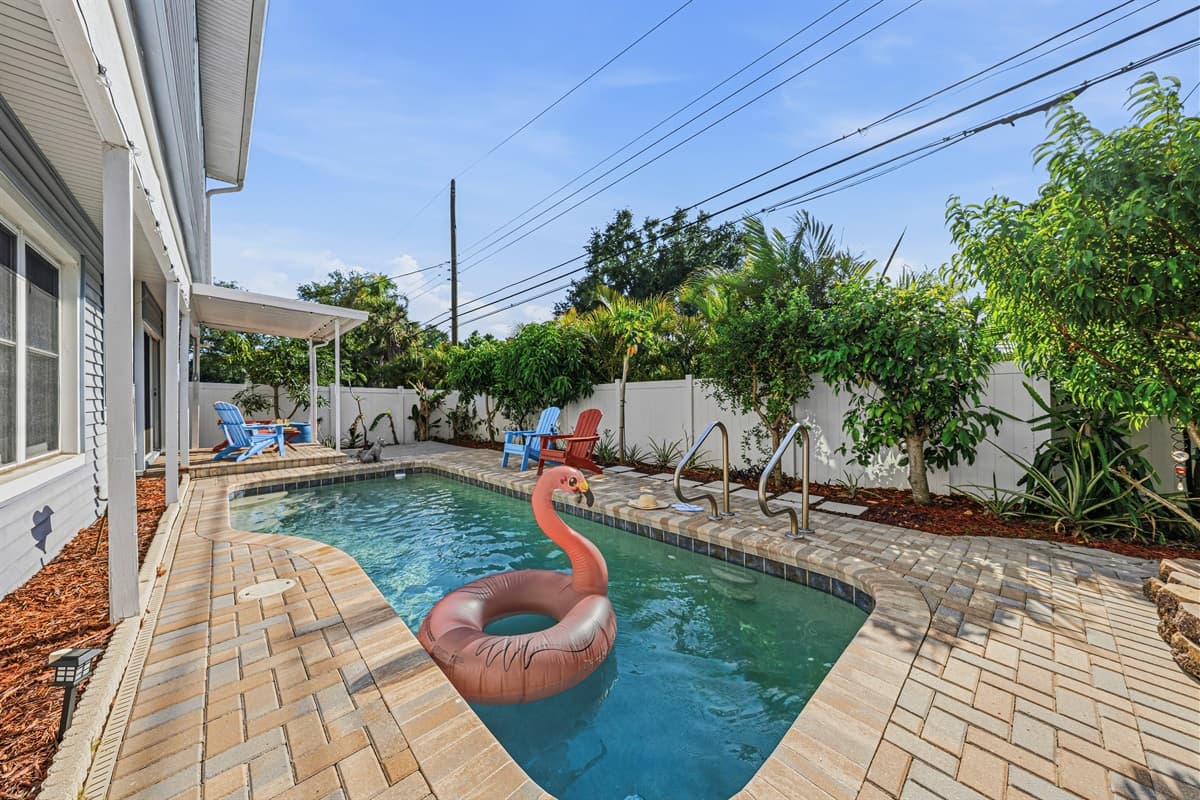 Private backyard oasis with sparkling pool, lounge seating, and plenty of space to relax under the Florida sun.