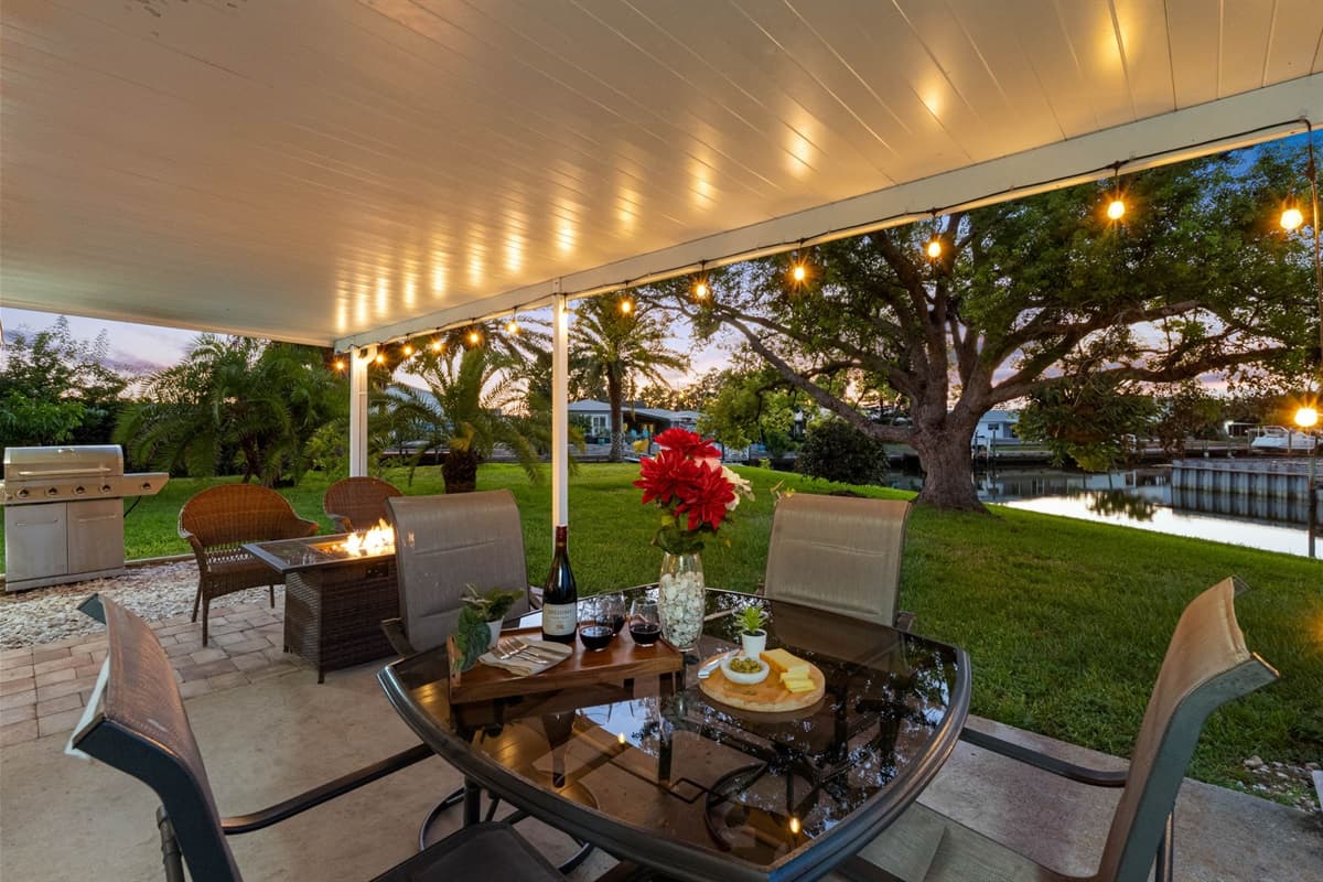 Unwind in the evening with a beautifully lit waterfront patio, designed for unforgettable nights outdoors.