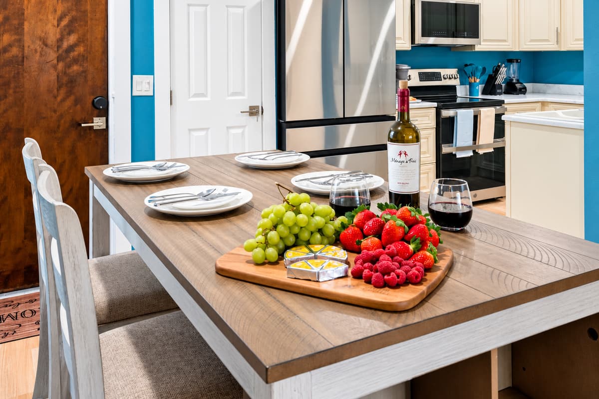 The dining area seamlessly blends with the surrounding kitchen, allowing for easy and convenient access to culinary delights.