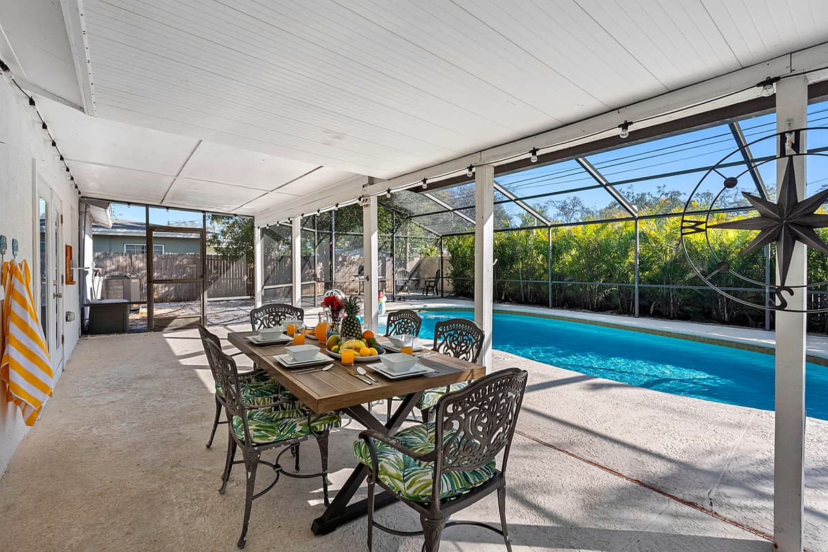 The outdoor poolside dining area is thoughtfully positioned for easy access and great views of the pool, enhancing the experience of every meal.