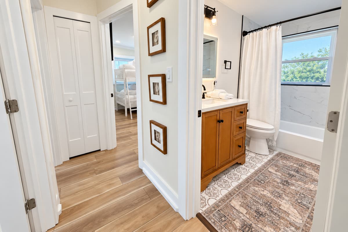 Interior hallway connecting bedrooms and the second bathroom.