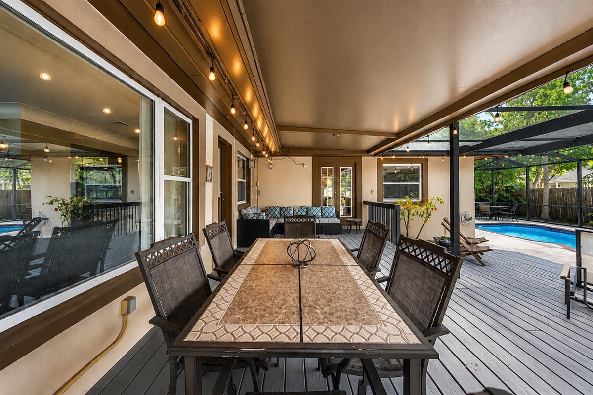 Relaxing patio setup with plenty of seating and peaceful backyard surroundings.
