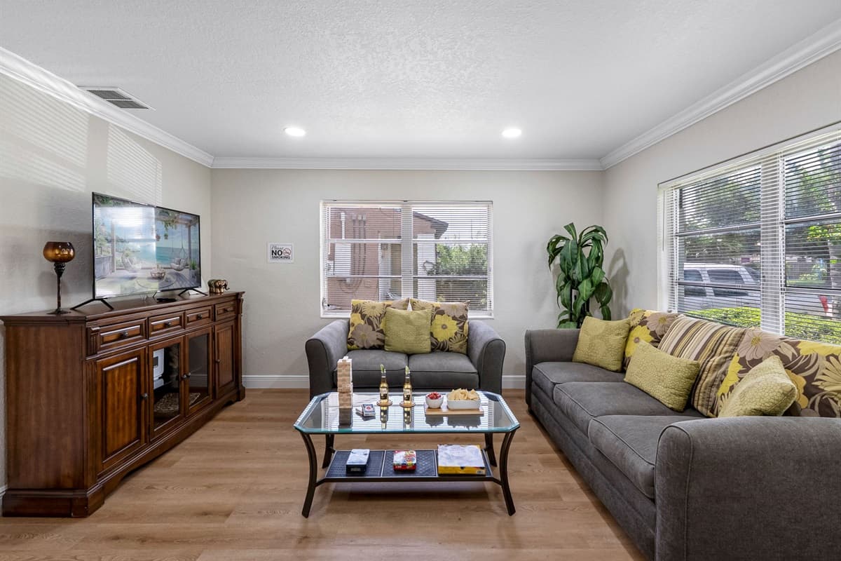 The neutral tones not only add to the calming ambiance but also complement the room’s natural light, which pours in through well-placed windows and brightens the entire space throughout the day.