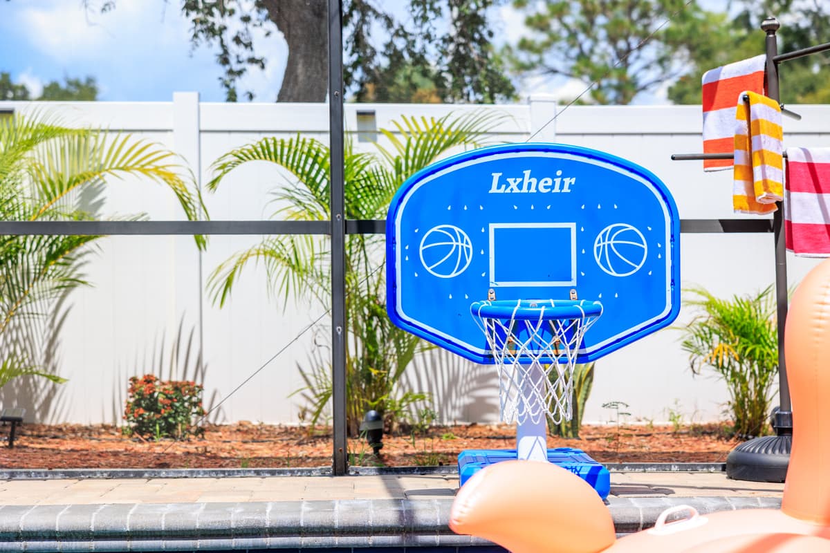 Screened-in pool and outdoor lounge space.