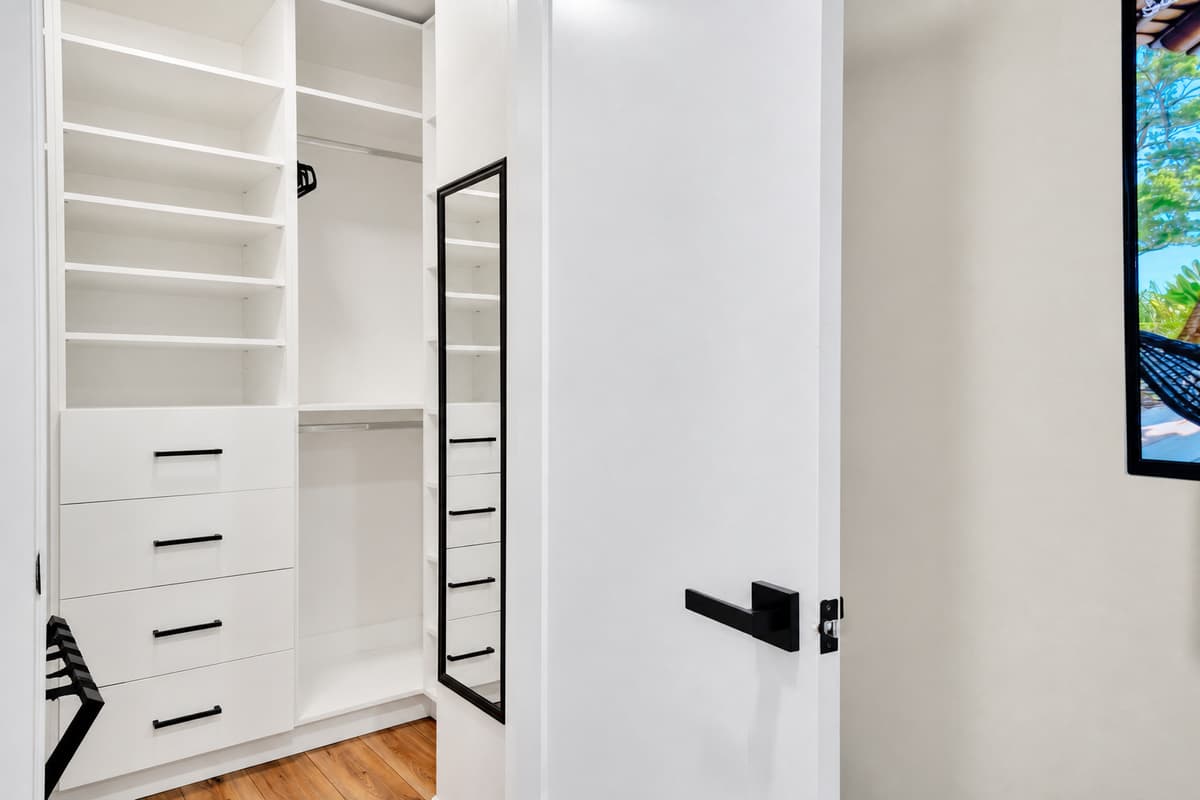 Room for a week of clothes, not a weekend's. Built-in drawers, hanging space and shelving in a walk-in closet of your own — the difference between staying somewhere and actually living there for a while.