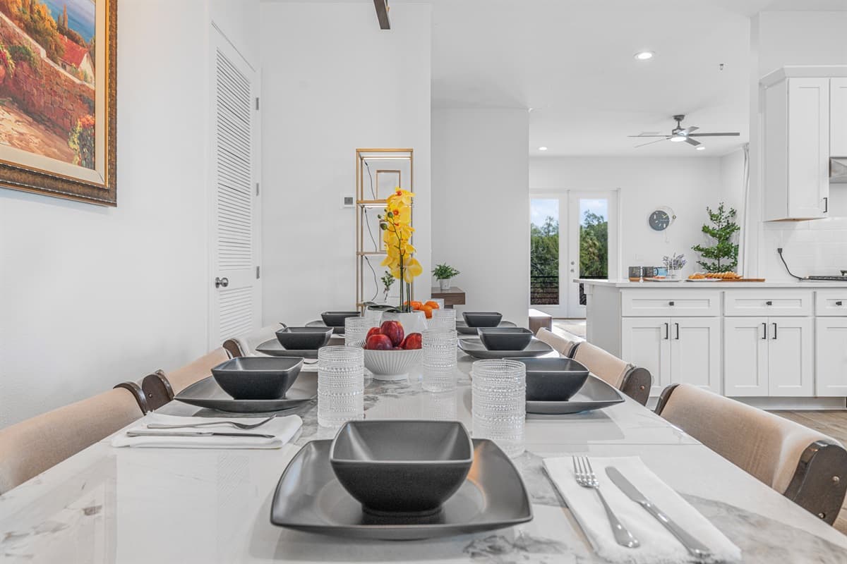 Dining table setup with modern place settings and clean design.