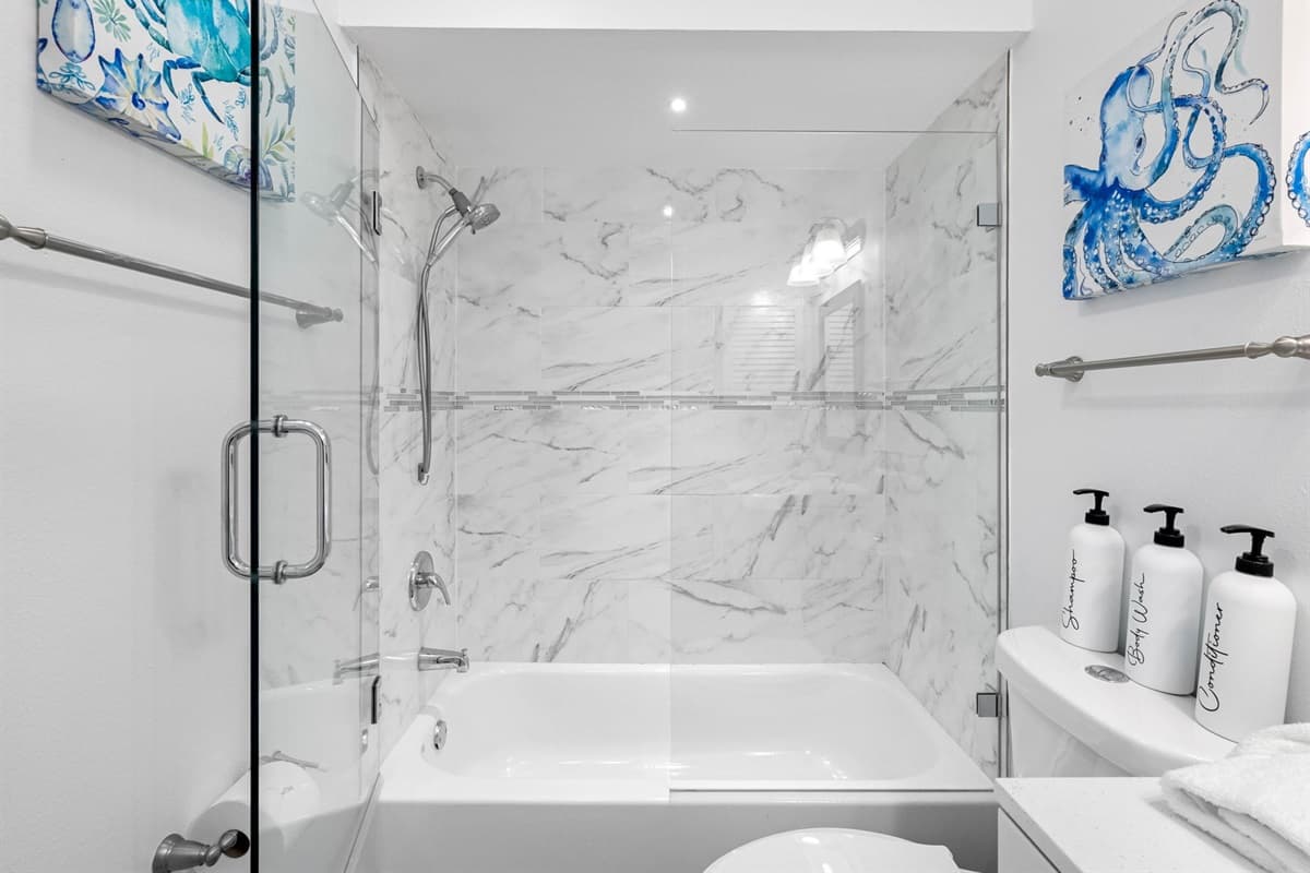 Perfect for soaking or a quick shower — this bathroom combines style with functionality.