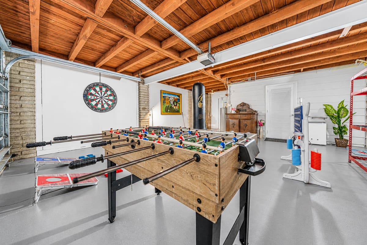 This expansive game room is built for fun, featuring multiple games and plenty of space for friendly competition and group entertainment.