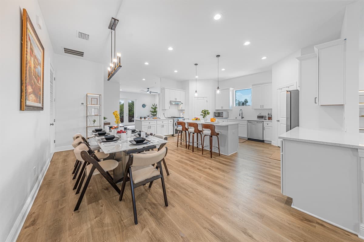 Spacious dining area connected to the kitchen, perfect for hosting family meals.