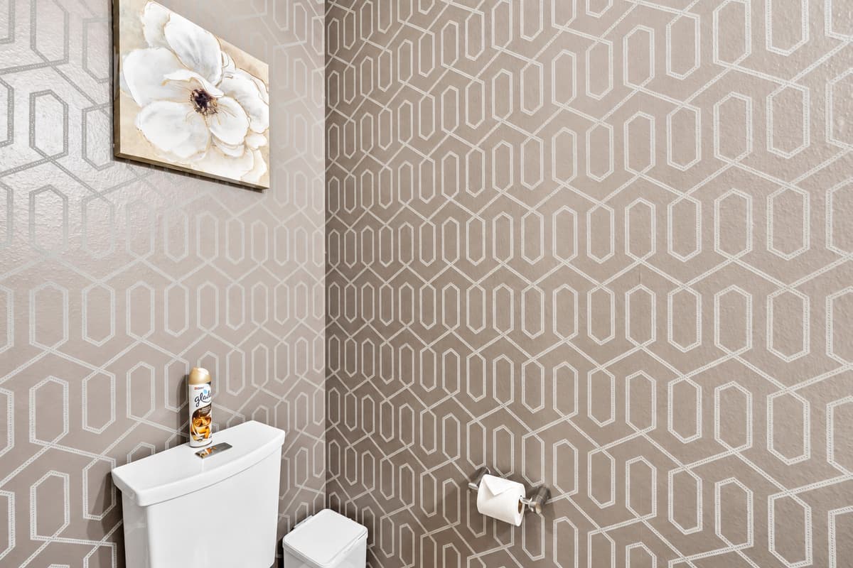 Soft lighting bathes the space in a warm glow, while subtle accents add a touch of personality and charm.