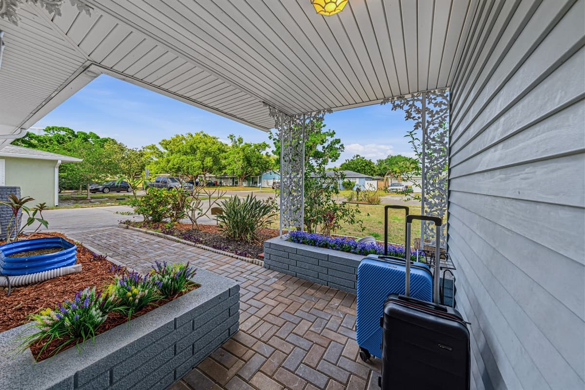 Side entrance walkway with clean landscaping and easy access to the home 