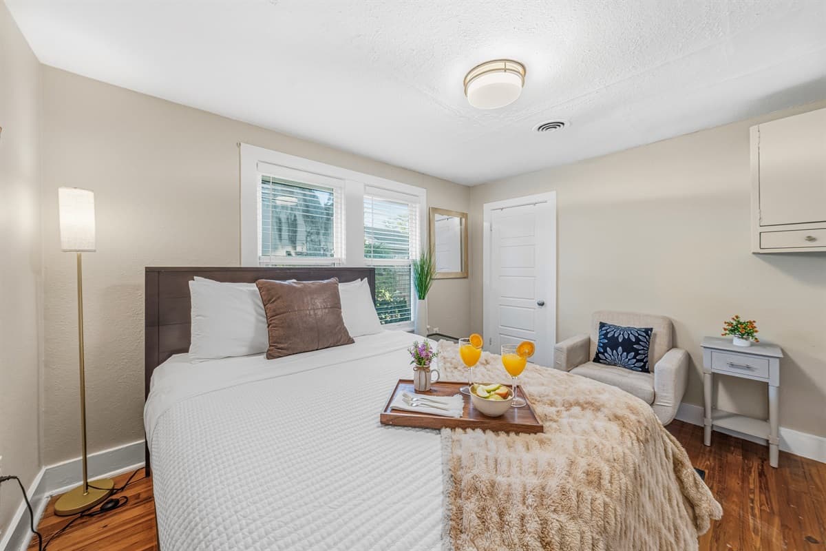 Comfortable bedroom with stylish décor and plenty of natural light.