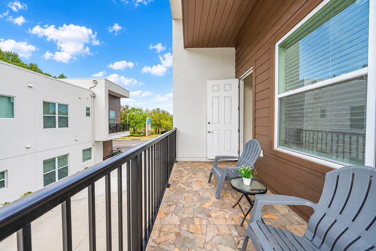 Your morning coffee has a new favorite spot. Two chairs, a side table, and open sky on your private balcony. Breathe the warm Florida air before the day starts, or unwind here at sunset while the rest of the house settles in.