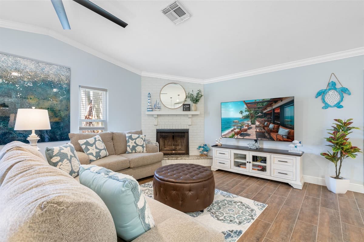 Centered in this inviting space is a beautifully designed smart TV, which not only enhances your entertainment experience but also adds a touch of modern sophistication to the room.