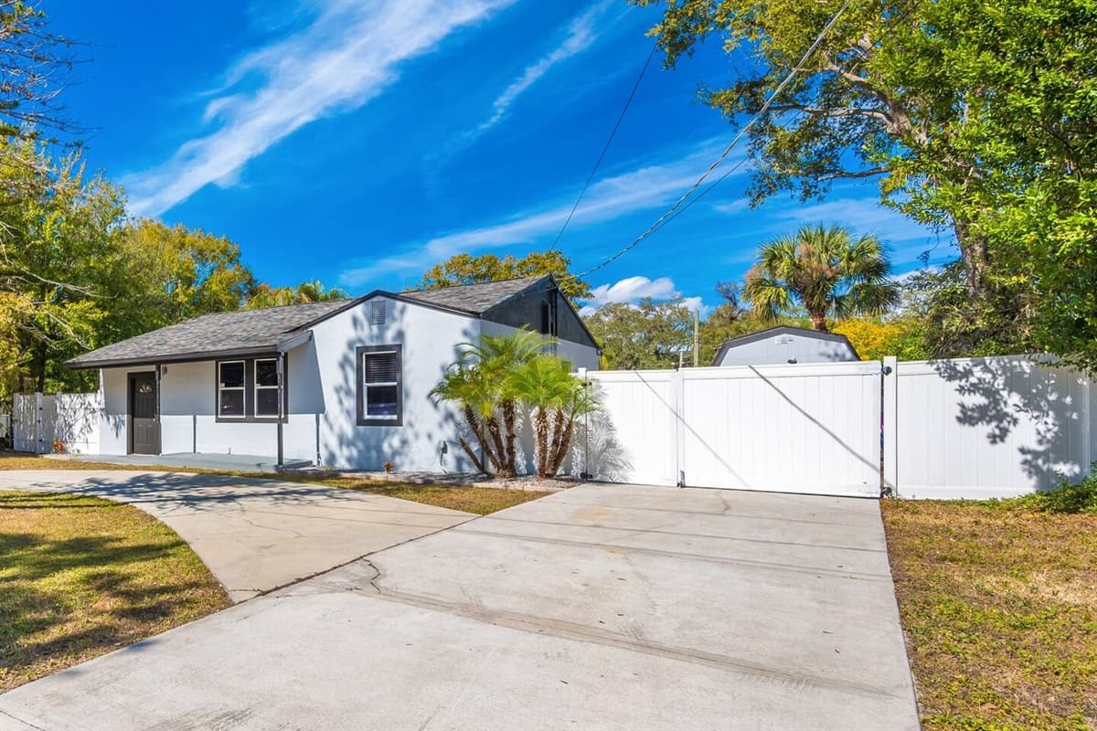 Stunning front view of the house showcasing the front yard and parking area that is equipped with CCTV cameras to ensure your safety during your stay. Send us a message if you have any questions!