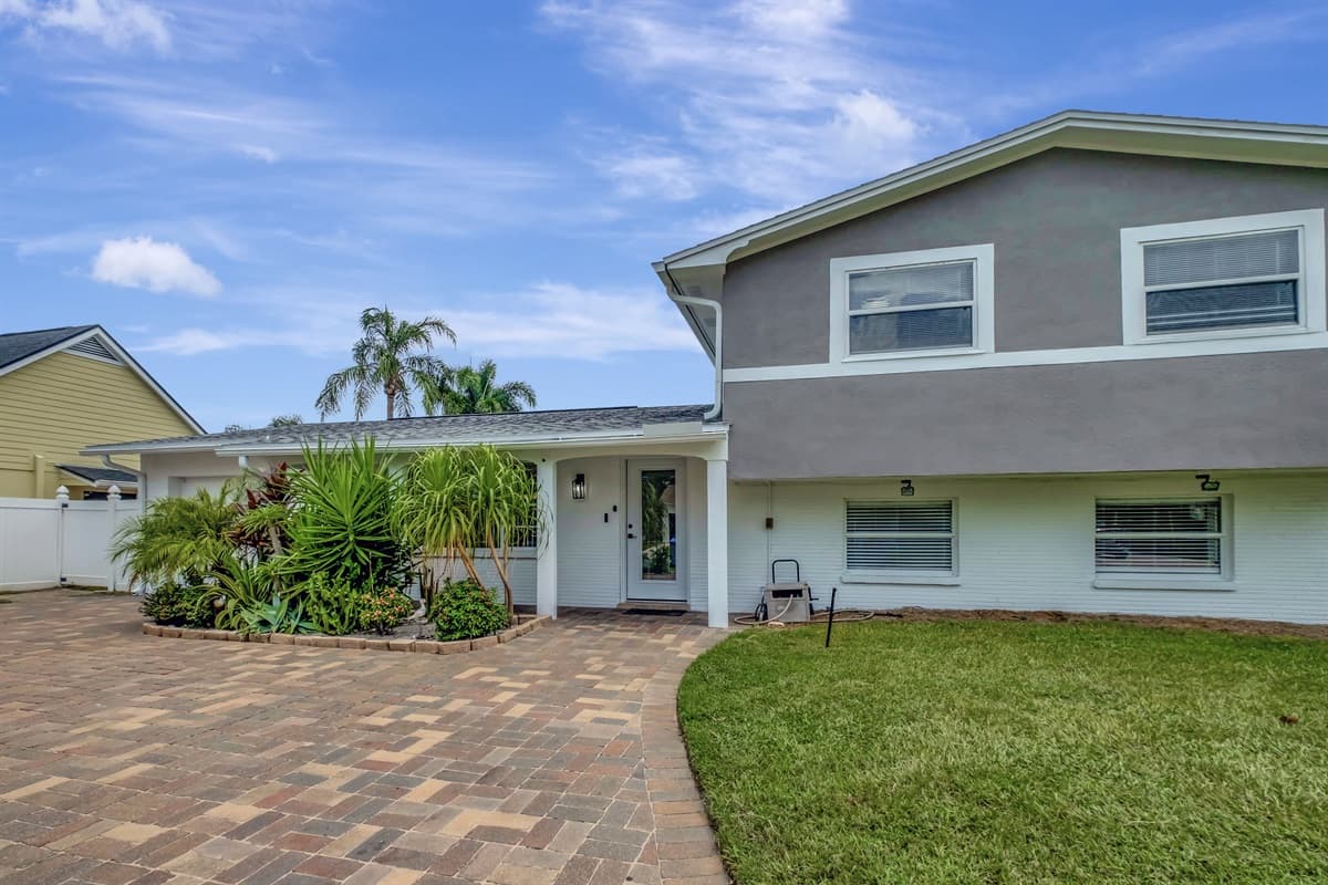Welcome to an inviting house exterior design that effortlessly blends charm and modernity.