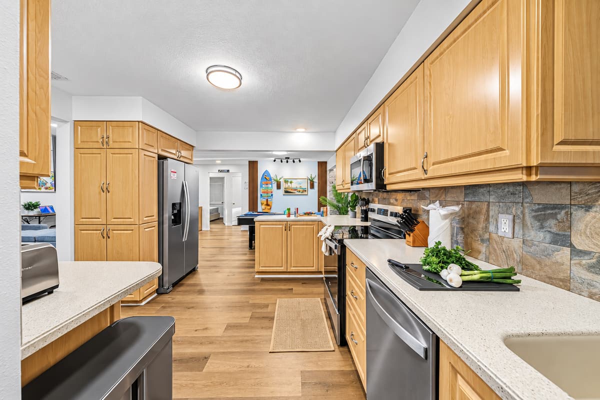 Spacious kitchen with ample counter space and modern appliances—perfect for preparing group meals 