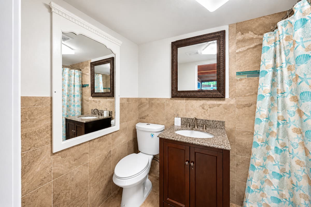 Outdoor Patio/Pool Bathroom
Convenient outdoor patio and pool bathroom, providing easy access for guests enjoying the pool and entertainment area.