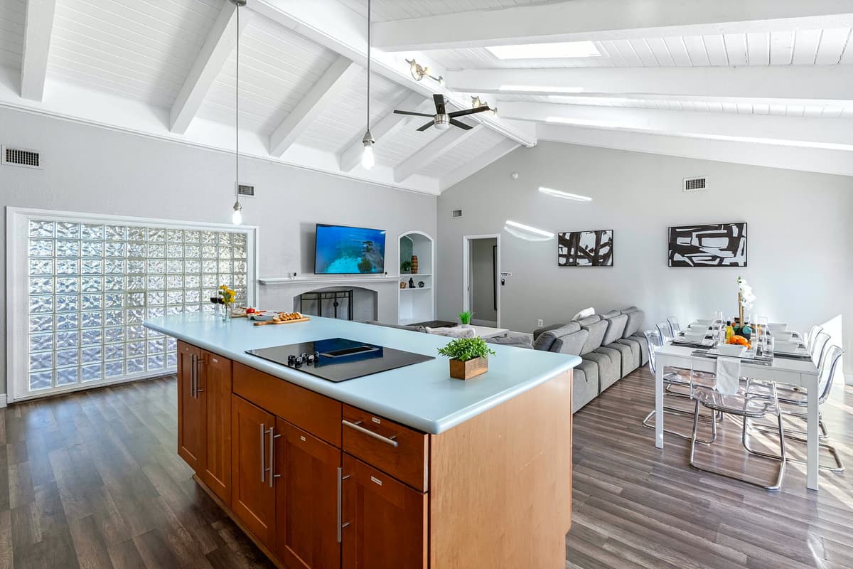 Clean lines, wood cabinetry, and soft lighting give this kitchen a polished, upscale feel.