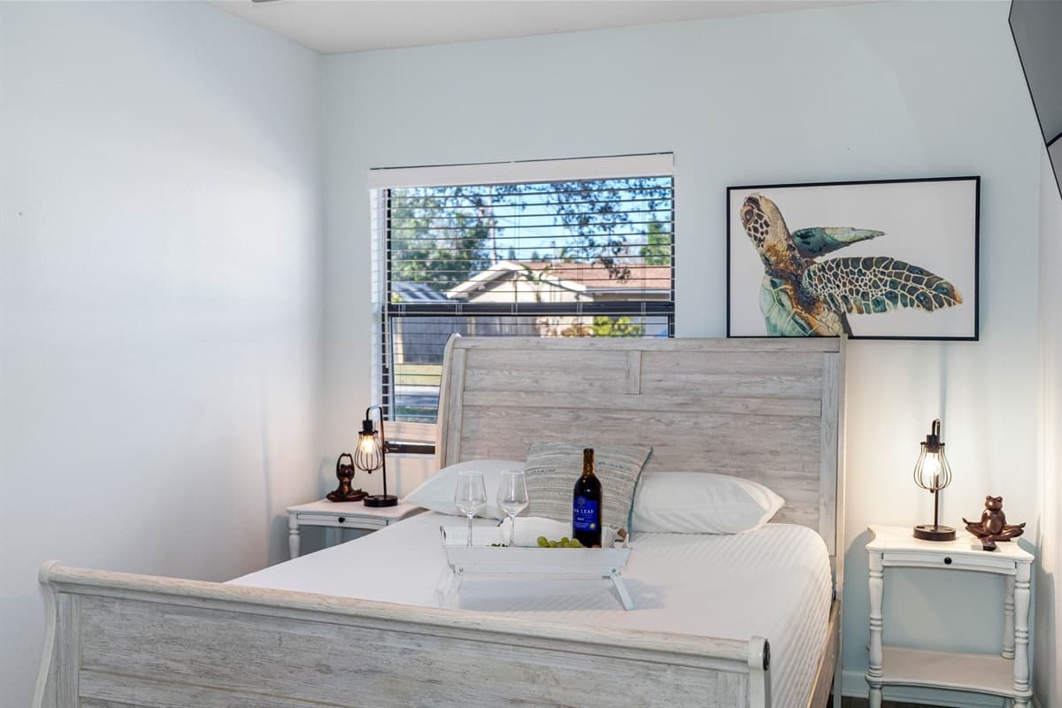 A large window allow natural light to brighten the room during the day, enhancing the airy feel of the space.