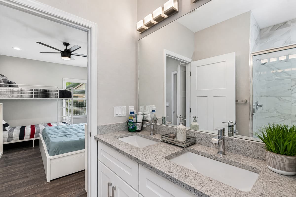 Beautiful bathroom equipped with sink, toilet, and shower. Enjoy a relaxing bath after a long day of travel from your home to your home away from home. If you think this property is for you, send us an inquiry right away!
