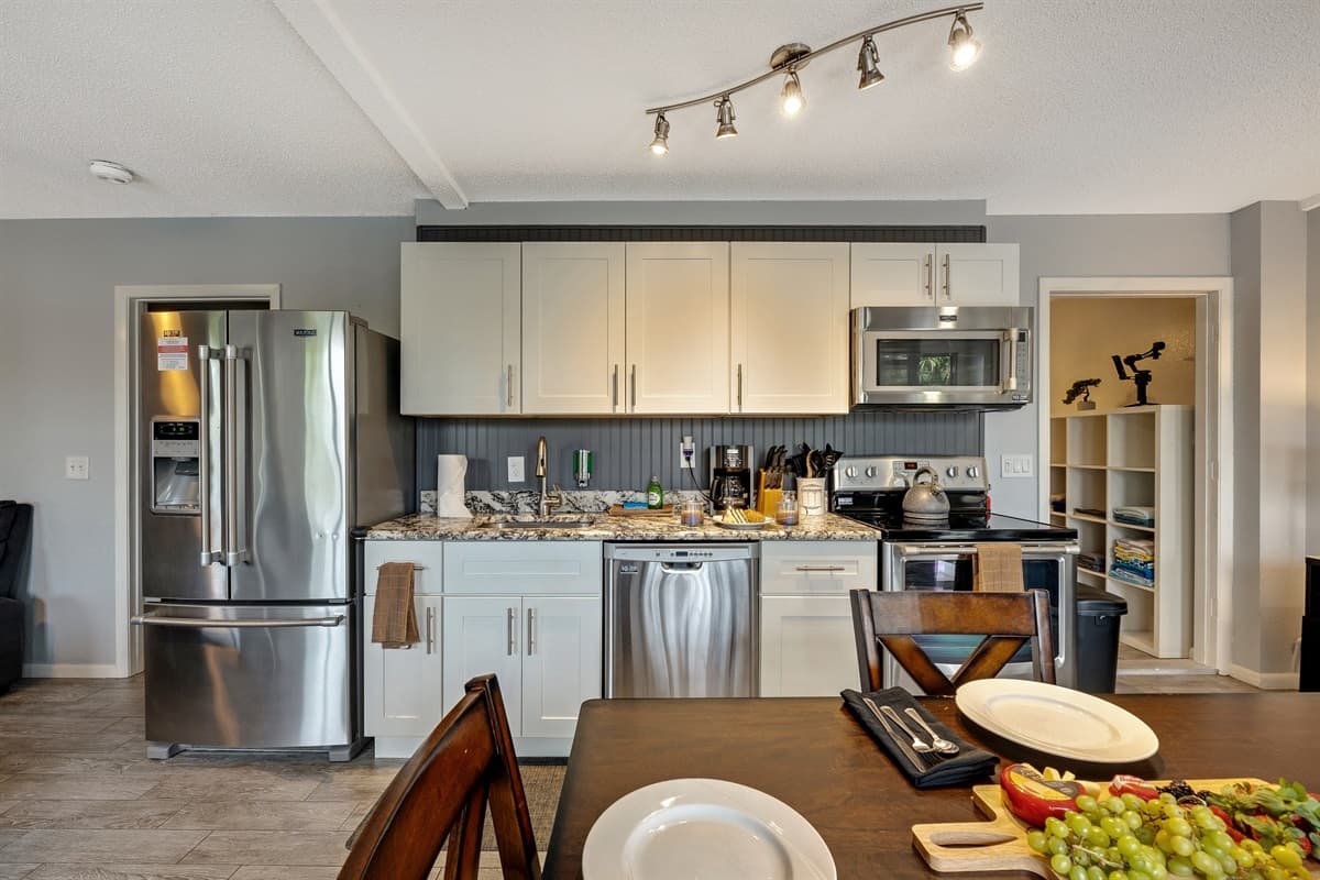 This dining area is more than a room with a table and chairs; it's a canvas for the tapestry of shared moments.