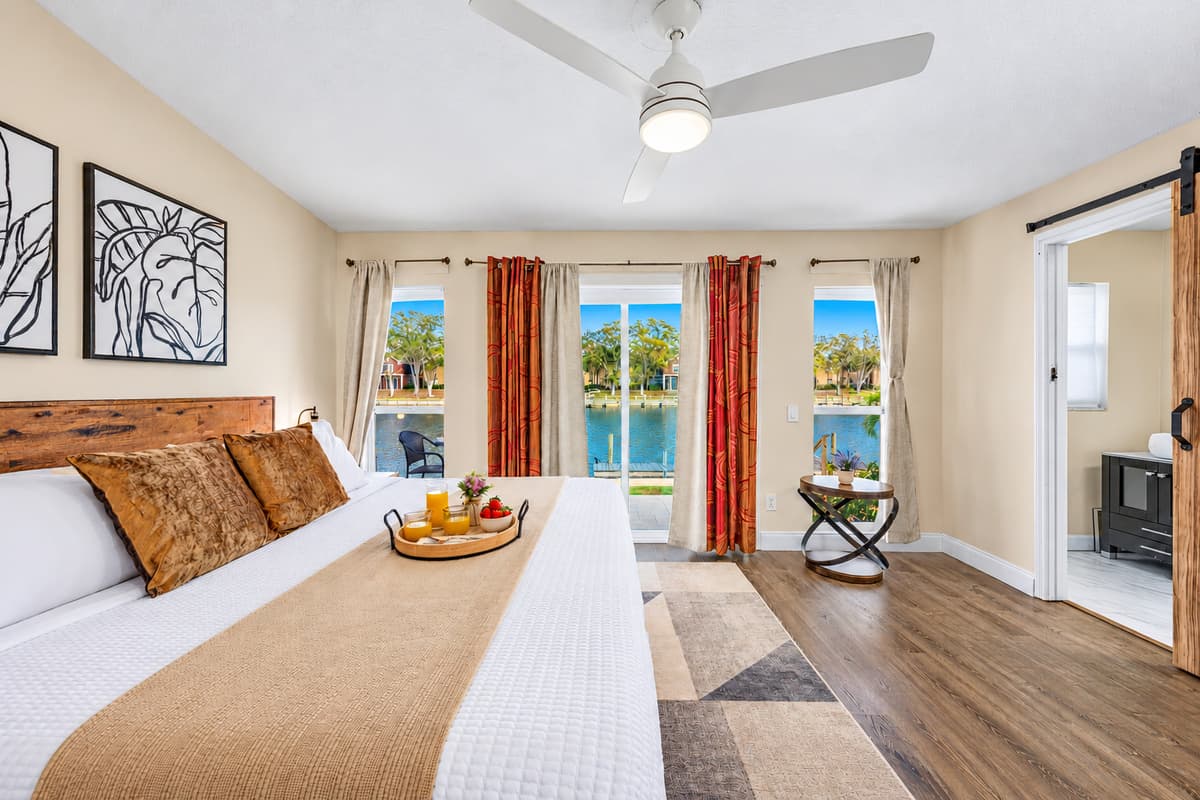 Wake up to tranquil water views from this spacious king bedroom.