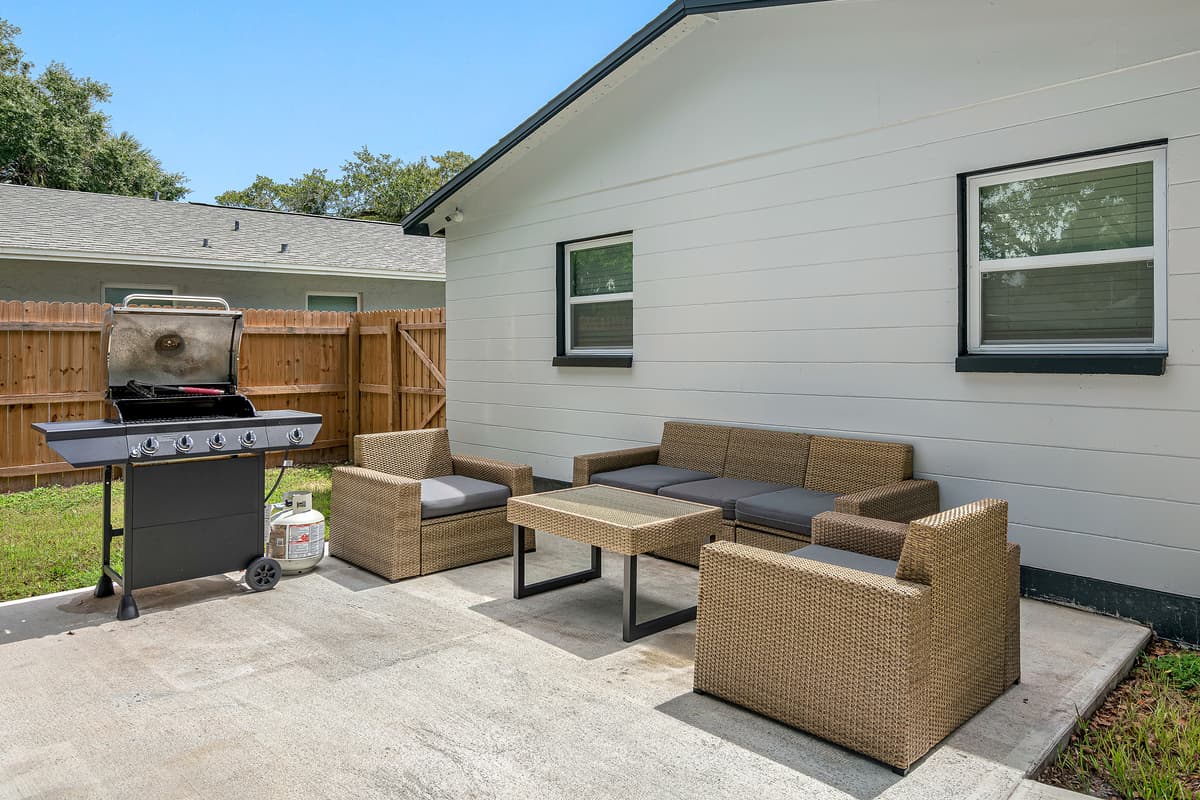 Lovely backyard with comfortable sitting area and charcoal griller. Enjoy good food while bonding with family and friends. 