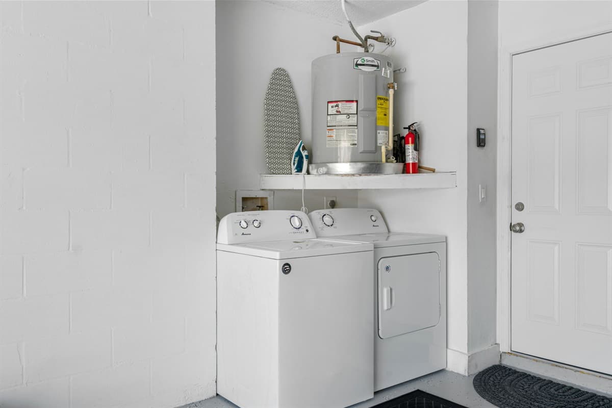 Laundry area, equipped with a washer and dryer.