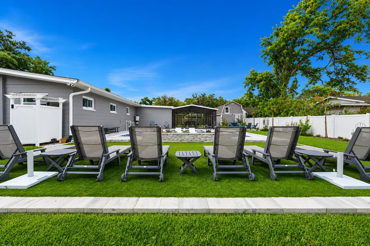 Cozy outdoor seating arrangement ideal for gathering around, relaxing, and enjoying the peaceful backyard setting.