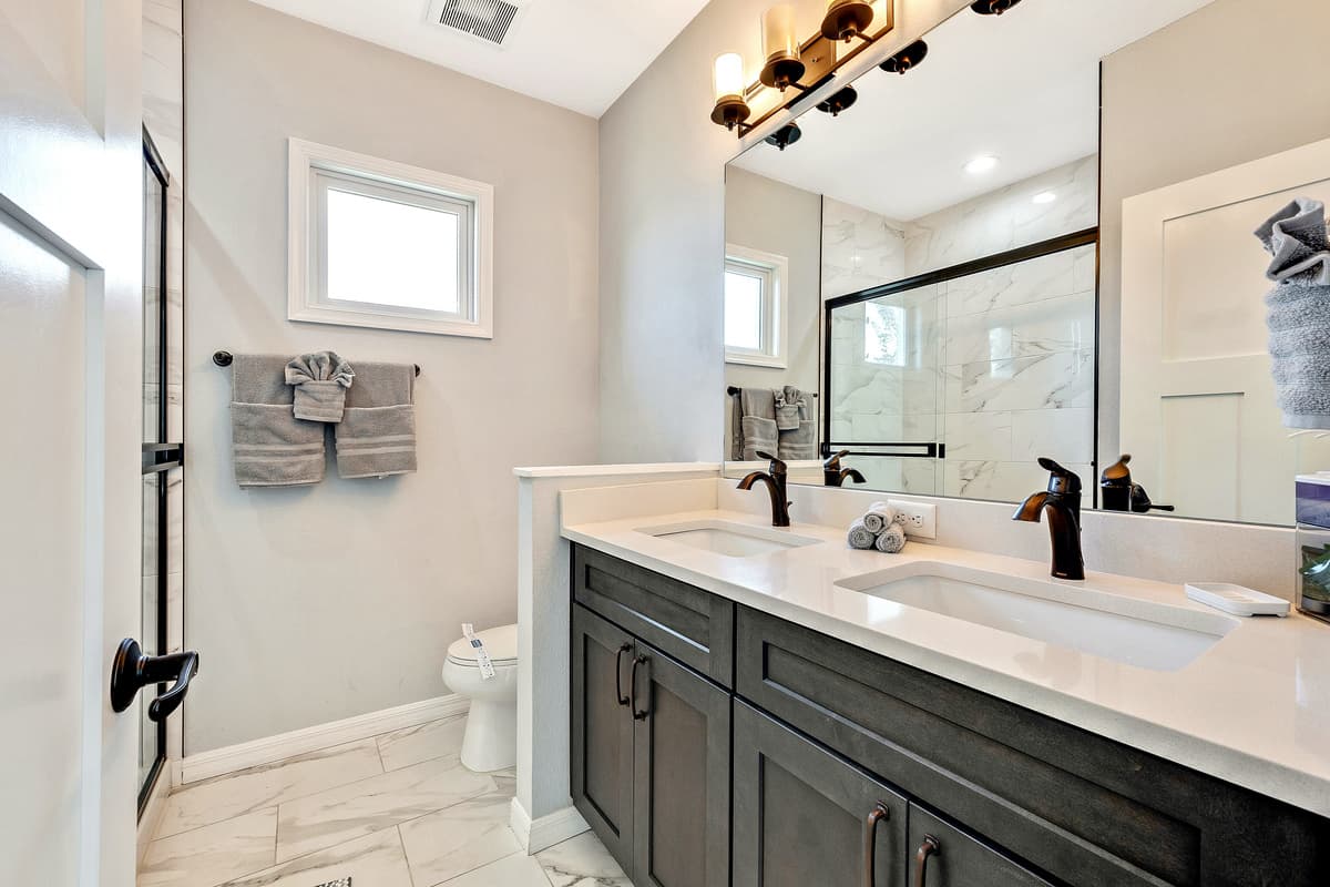Immerse yourself in the spa-like atmosphere, where sleek fixtures and tasteful finishes create an ambiance of sophistication.