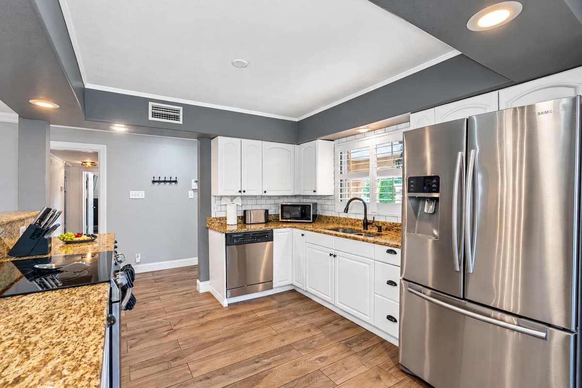Our kitchen is a feast for the eyes and the taste buds, with sleek appliances, stylish finishes, and ample space to cook up a storm.