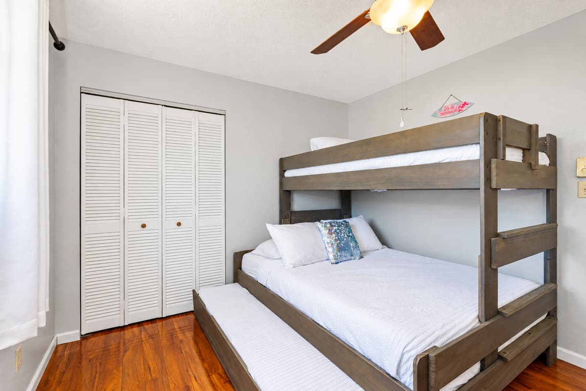 Relax in this thoughtfully furnished room featuring a bunk bed, modern furniture, and everything you need to feel right at home.
