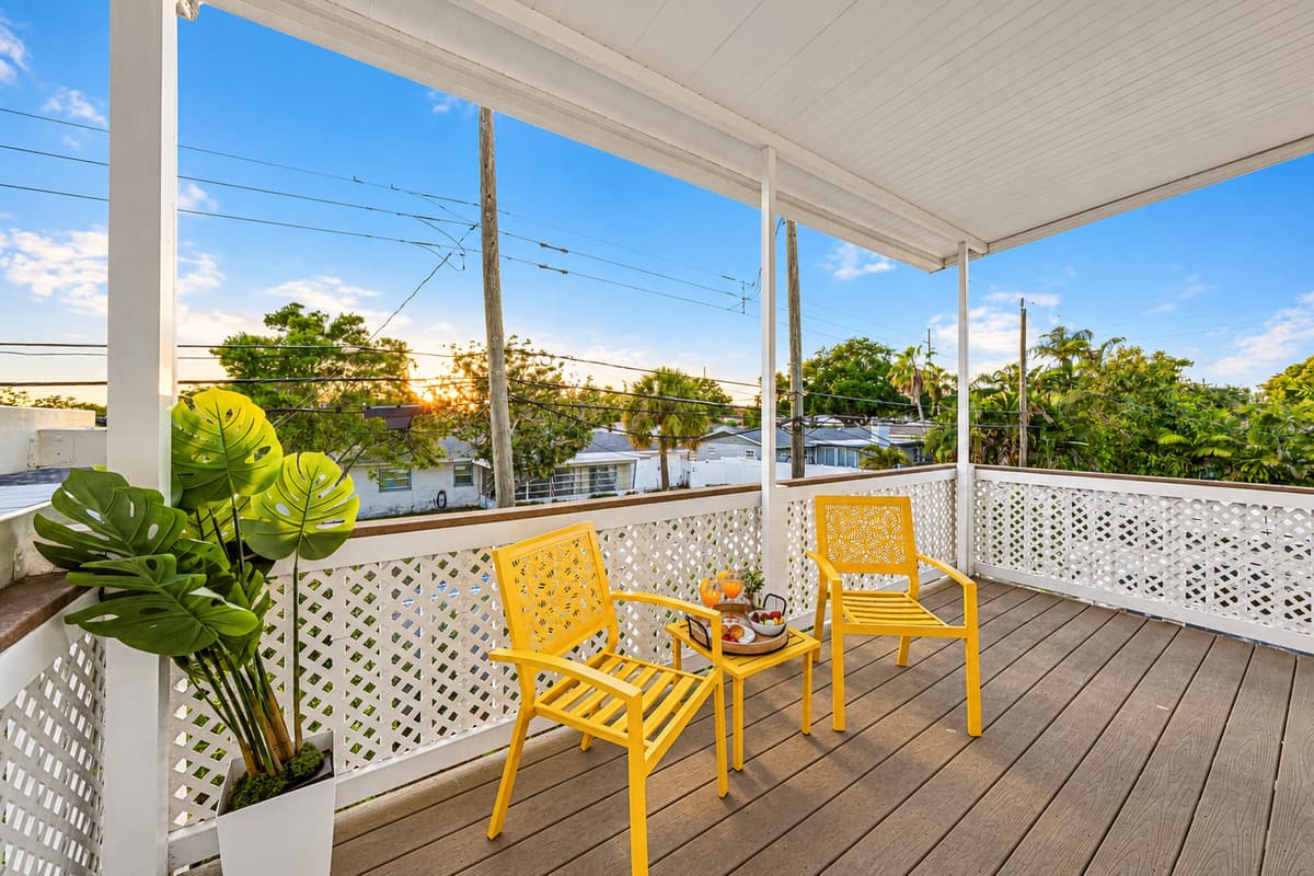 Cozy outdoor seating area with stylish décor and open-air views—great for unwinding 
Food and drinks shown are for staging purposes only and are not included.