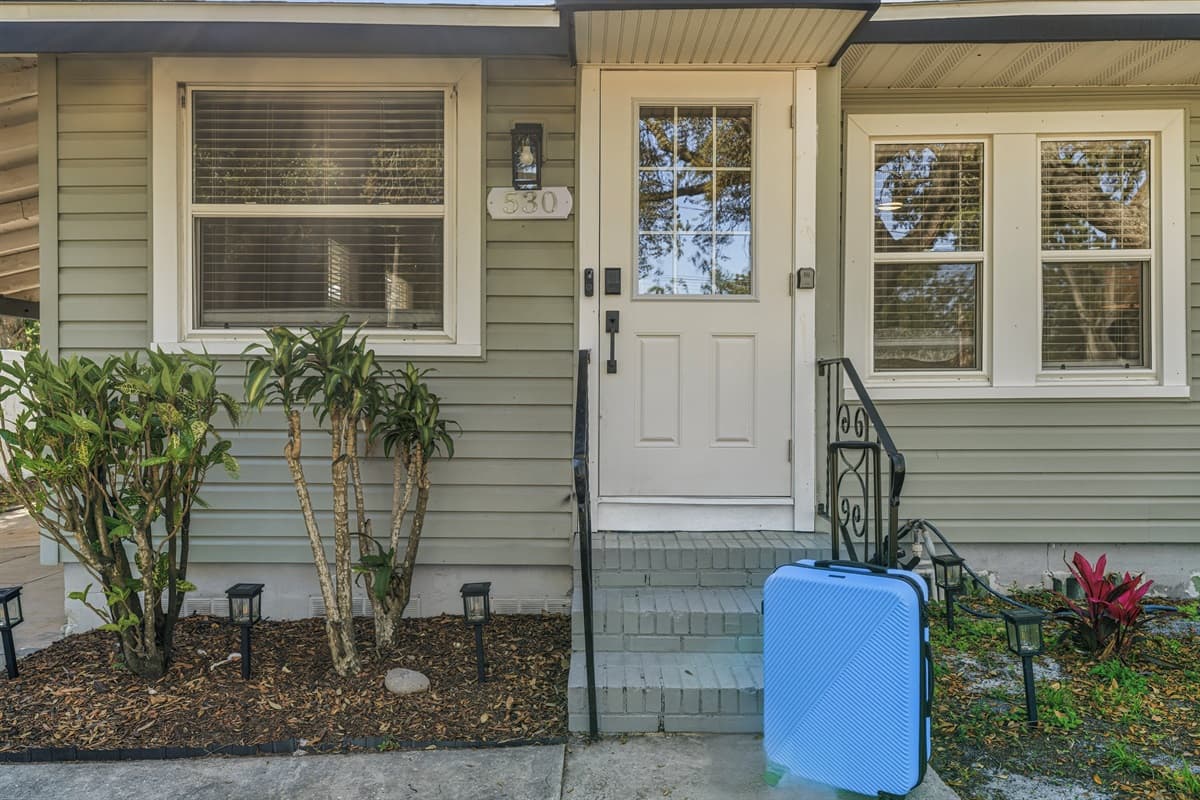 Front entryway with landscaped plants and clean exterior.